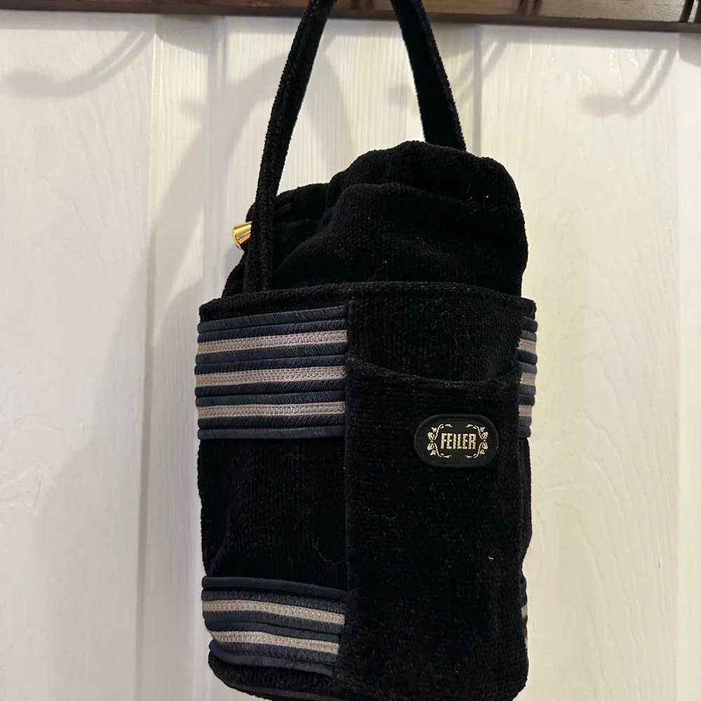 Black Satchel with Striped Accents and Plush Texture